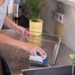 Unger Cookware and Bakeware Dish Scrubbing Brush with Scraper, Kitchen and Dish Washing Scrubber, Non-Slip Cleaning Supplies, Tackle Stuck-On Food in Baking Dishes, Dishwasher Safe - Image 3